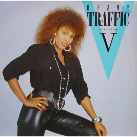 Heavy Traffic Featuring V - 10 Track Debut LP Featuring SOS / Lets Go Crazy / Coming Down With Love / Promises In The Dark